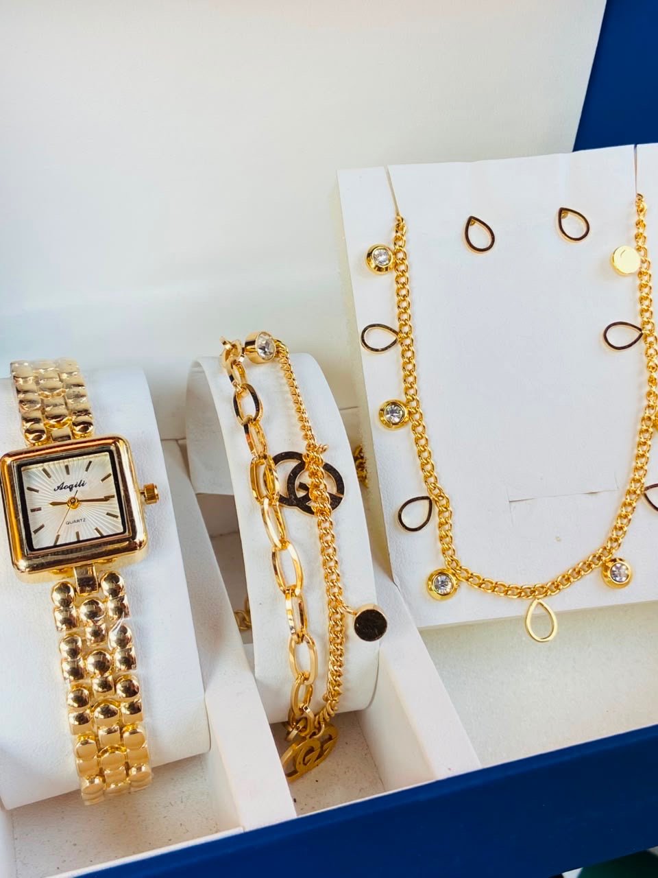 Gold Watch and Bracelets