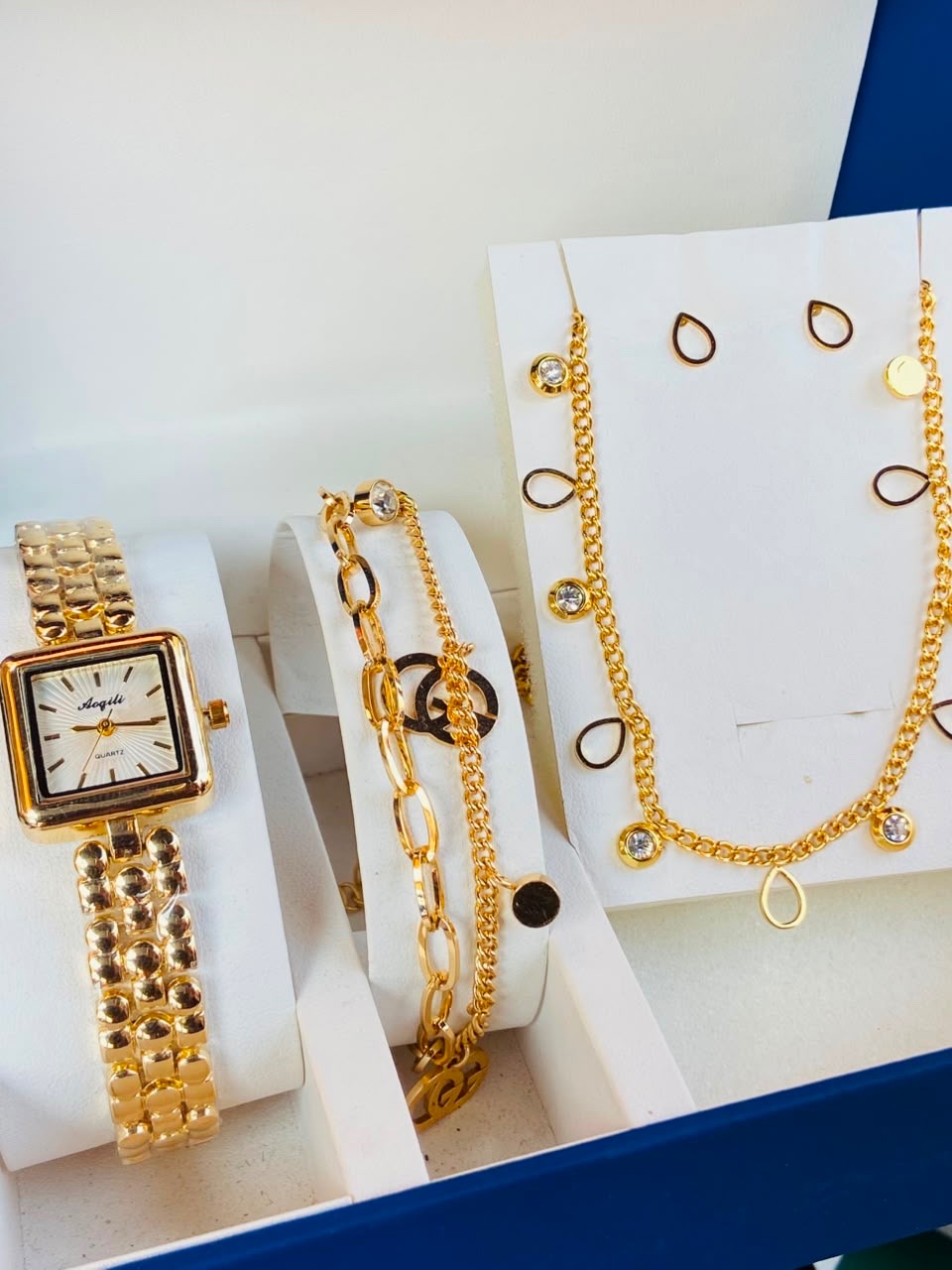 Gold Watch and Bracelets